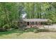 Charming brick home with a well-manicured lawn and beautiful landscaping at 3139 Mary Dr, Marietta, GA 30066