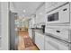 Stylish kitchen equipped with white cabinets, stainless steel microwave, and modern appliances at 3139 Mary Dr, Marietta, GA 30066
