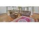 Open-concept living space with hardwood floors and bar-style seating at 3139 Mary Dr, Marietta, GA 30066