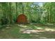 View of the red storage shed in the backyard offering additional storage at 3139 Mary Dr, Marietta, GA 30066
