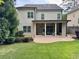Spacious backyard with a covered patio and an outdoor seating area perfect for entertaining at 3699 School Street, Chamblee, GA 30341