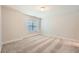 Cozy bedroom with neutral carpet, a window, and lots of natural light at 3699 School Street, Chamblee, GA 30341