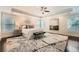 Spacious main bedroom with a tray ceiling, large windows, and hardwood floors at 3699 School Street, Chamblee, GA 30341