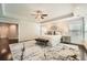 Spacious main bedroom with trey ceiling, dark hardwood floors, and large windows offering natural light at 3699 School Street, Chamblee, GA 30341