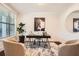 Bright office with a large window, neutral walls, modern desk, stylish rug and a horse picture at 3699 School Street, Chamblee, GA 30341