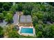 This aerial view highlights a community pool, tennis court and other amenities at 3987 Ivory Gables Pl, Buford, GA 30519