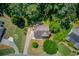 An aerial shot of the beautiful home with a well-manicured lawn and a large backyard at 3987 Ivory Gables Pl, Buford, GA 30519