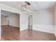 Dining room with hard wood floors, white wainscoting and trim, and access to other rooms at 3987 Ivory Gables Pl, Buford, GA 30519