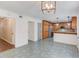 View of the kitchen area with stainless steel appliances and granite countertops from the dining area at 3987 Ivory Gables Pl, Buford, GA 30519