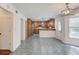 Kitchen and dining area boasts tile flooring, wooden cabinets, stainless steel appliances and good natural light at 3987 Ivory Gables Pl, Buford, GA 30519