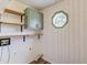 Charming laundry room with unique wallpaper and natural light at 3987 Ivory Gables Pl, Buford, GA 30519