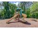 Community playground featuring slides and play area, providing a fun space for children in a natural setting at 3987 Ivory Gables Pl, Buford, GA 30519