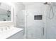 Bathroom with marble tile shower, frameless glass and modern fixtures at 6891 Hickory Log Rd, Austell, GA 30168