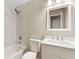 Updated bathroom with marble tile, white vanity, and new fixtures at 6891 Hickory Log Rd, Austell, GA 30168