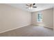 Bedroom with carpet, window, and ceiling fan at 6891 Hickory Log Rd, Austell, GA 30168