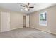 Spacious bedroom with neutral carpet, double door closet and window at 6891 Hickory Log Rd, Austell, GA 30168