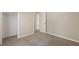 Bedroom featuring new carpet, open closet, and fresh paint at 6891 Hickory Log Rd, Austell, GA 30168