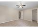 Bedroom with new carpeting, ceiling fan, and closet at 6891 Hickory Log Rd, Austell, GA 30168