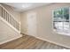 Bright entryway with hardwood floors, stairs and natural light at 6891 Hickory Log Rd, Austell, GA 30168