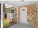 Close-up of the front porch with stone details and a classic white front door at 6891 Hickory Log Rd, Austell, GA 30168
