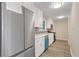 Spacious kitchen boasts stainless steel refrigerator and appliances, and modern countertops at 6891 Hickory Log Rd, Austell, GA 30168