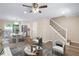 Bright living room featuring hardwood floors, modern decor, and an open concept layout at 6891 Hickory Log Rd, Austell, GA 30168