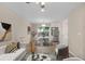Bright living room featuring hardwood floors, modern decor, and an open concept layout at 6891 Hickory Log Rd, Austell, GA 30168