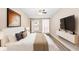 Relaxing bedroom features a ceiling fan, neutral walls, and an abundance of natural light at 6891 Hickory Log Rd, Austell, GA 30168