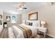 Cozy bedroom with ceiling fan, neutral walls, and an abundance of natural light at 6891 Hickory Log Rd, Austell, GA 30168