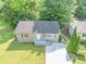 Aerial view of a charming single-story home with a well-manicured lawn at 1677 Wayland Ne Cir, Brookhaven, GA 30319