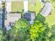 A high-angle view of the property and surrounding neighborhood with mature trees at 1677 Wayland Ne Cir, Brookhaven, GA 30319