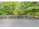 Back deck overlooks backyard with green trees at 1677 Wayland Ne Cir, Brookhaven, GA 30319