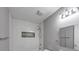 Modern bathroom with tiled shower, mosaic accent and gray walls at 1677 Wayland Ne Cir, Brookhaven, GA 30319
