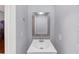 Bathroom featuring a single vanity, mirror, and gray walls at 1677 Wayland Ne Cir, Brookhaven, GA 30319