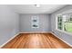 Bedroom featuring newly refinished hardwood floors, neutral walls and large windows at 1677 Wayland Ne Cir, Brookhaven, GA 30319
