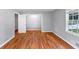 Bedroom featuring hardwood floors, closet, and large window at 1677 Wayland Ne Cir, Brookhaven, GA 30319