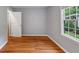Bedroom with hardwood floors, a large window and neutral walls at 1677 Wayland Ne Cir, Brookhaven, GA 30319