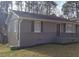Cozy home featuring a charming front porch, gray wood siding, and black window shutters at 1677 Wayland Ne Cir, Brookhaven, GA 30319