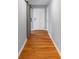 Hallway featuring newly refinished hardwood floors, neutral walls and white trim throughout at 1677 Wayland Ne Cir, Brookhaven, GA 30319