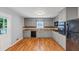 Kitchen with grey cabinets, hardwood floors and appliances at 1677 Wayland Ne Cir, Brookhaven, GA 30319