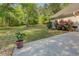 Inviting backyard with mature landscaping, an outdoor patio, and potential for gardening or play areas at 2611 Fireside Sw Trl, Conyers, GA 30094