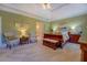 Bedroom featuring elegant furnishings, soft lighting, and access to an ensuite bathroom for convenience at 2611 Fireside Sw Trl, Conyers, GA 30094