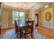 Dining room featuring hardwood floors and chandelier at 2611 Fireside Sw Trl, Conyers, GA 30094