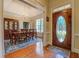 Elegant foyer featuring hardwood floors, dining room, and decorative front door at 2611 Fireside Sw Trl, Conyers, GA 30094