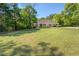 Beautiful brick home with lush green lawn and mature trees at 2611 Fireside Sw Trl, Conyers, GA 30094