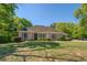 Charming brick home with manicured landscaping and inviting curb appeal at 2611 Fireside Sw Trl, Conyers, GA 30094