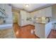 Spacious kitchen with granite countertops and white cabinetry at 2611 Fireside Sw Trl, Conyers, GA 30094