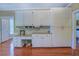 Spacious kitchen featuring custom cabinets with granite counters and a convenient built-in desk area at 2611 Fireside Sw Trl, Conyers, GA 30094