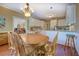 Eat-in kitchen with a table and wood floors at 2611 Fireside Sw Trl, Conyers, GA 30094