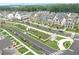 Aerial view of the community garden, walking trails and newly constructed homes within the Primary planned community at 3003 Clayton St, Woodstock, GA 30188